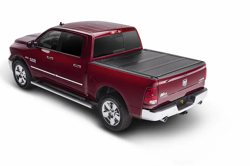 BAK Industries BAKFlip F1 Hard Folding Truck Bed Cover - Rail Mounts Near Top of Bed Rail for Rails Can Be Lowered Using Drop Down Brackets - 2007-2021 Toyota Tundra 5' 6" Bed without Deck Rail System without Trail Special Edition Storage Boxes 772409